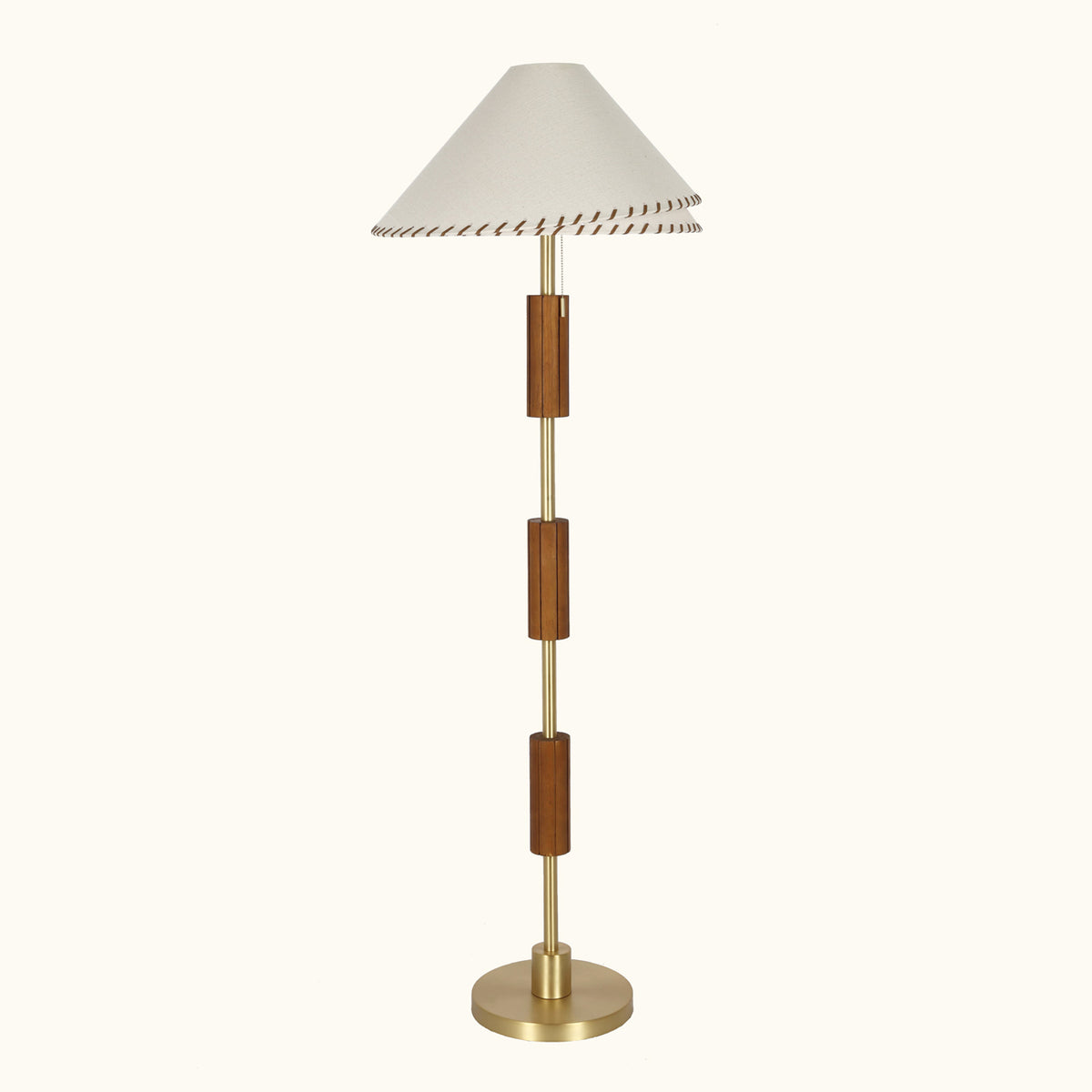 Zali Floor Lamp – sculptural wooden floor lamp shown in a styled setting by Paola And Joy