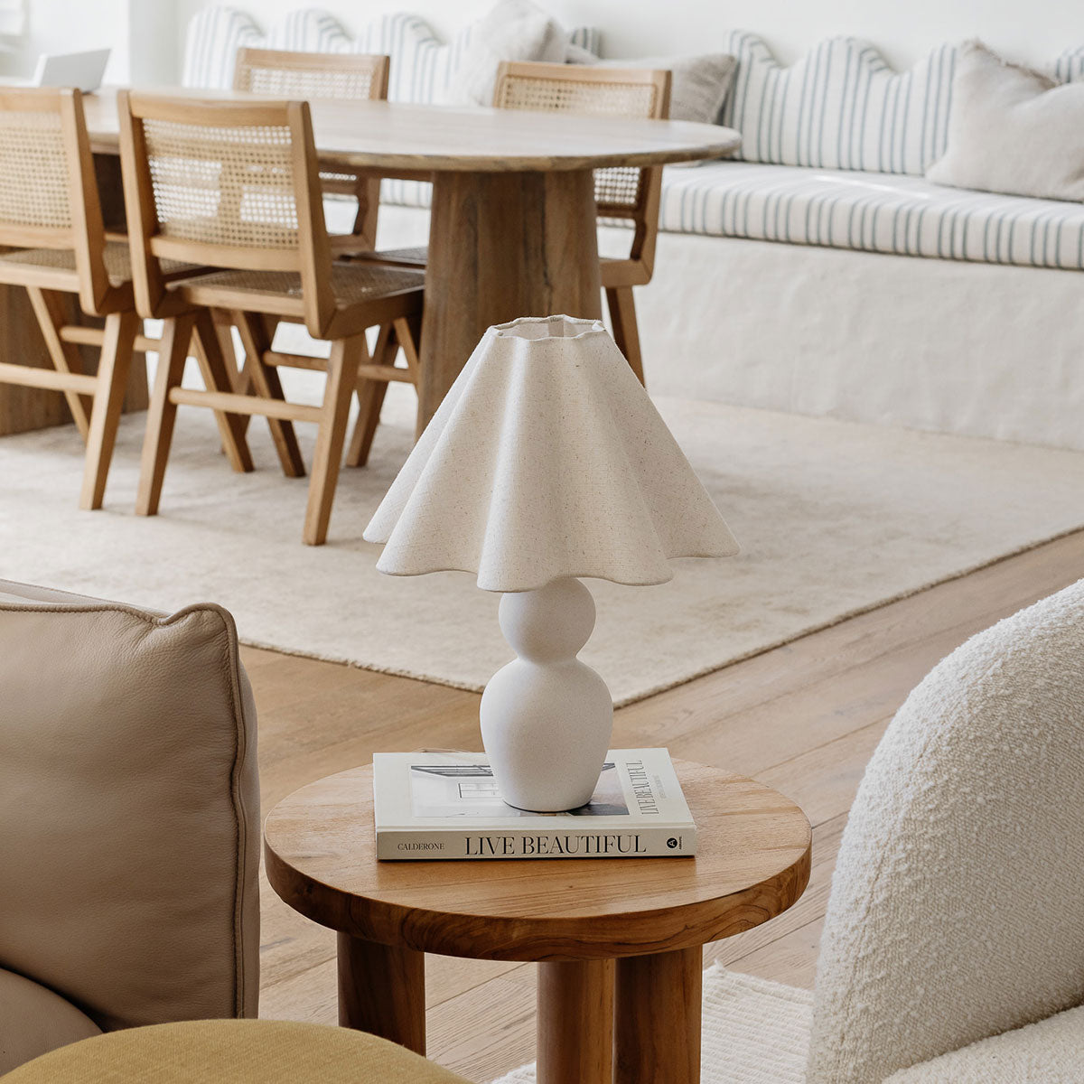 Mila Table Lamp – cream sculptural lamp shown in a styled setting by Paola And Joy