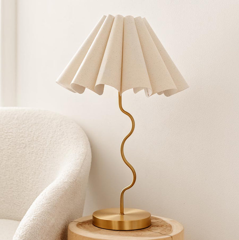 Cora Table Lamp – cream linen fluted shade on a brass squiggly base by Paola And Joy