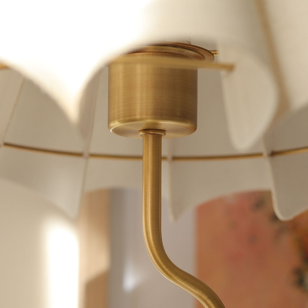 Cora Table Lamp – side profile of the brass squiggly base and fluted linen shade by Paola And Joy